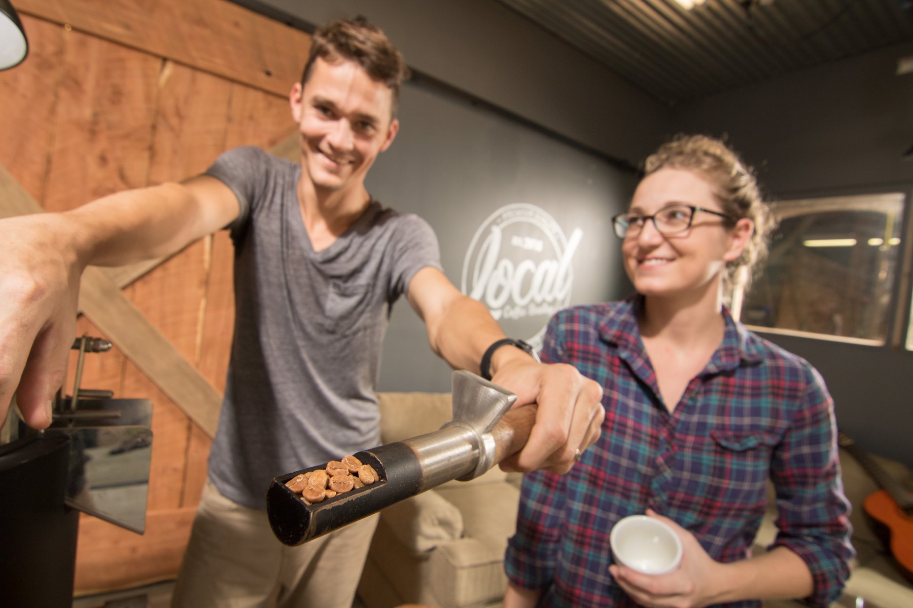 Tyler and Jenni Valliant with coffee equipment