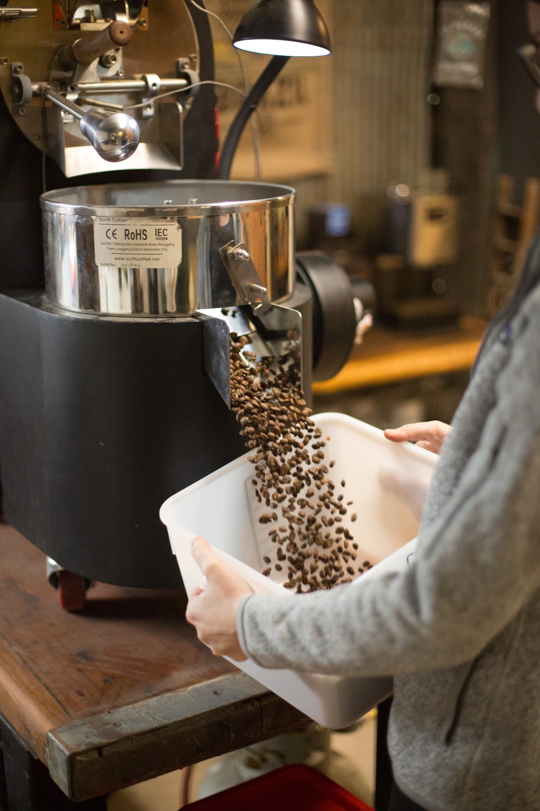 Freshly roasted coffee coming out of the Local Coffee roaster